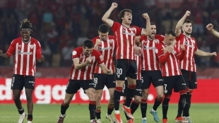 The Athletic Club players celebrate a scored penalty.
