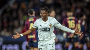 <p>Largie Ramazani celebrates a goal scored with Valencia</p>