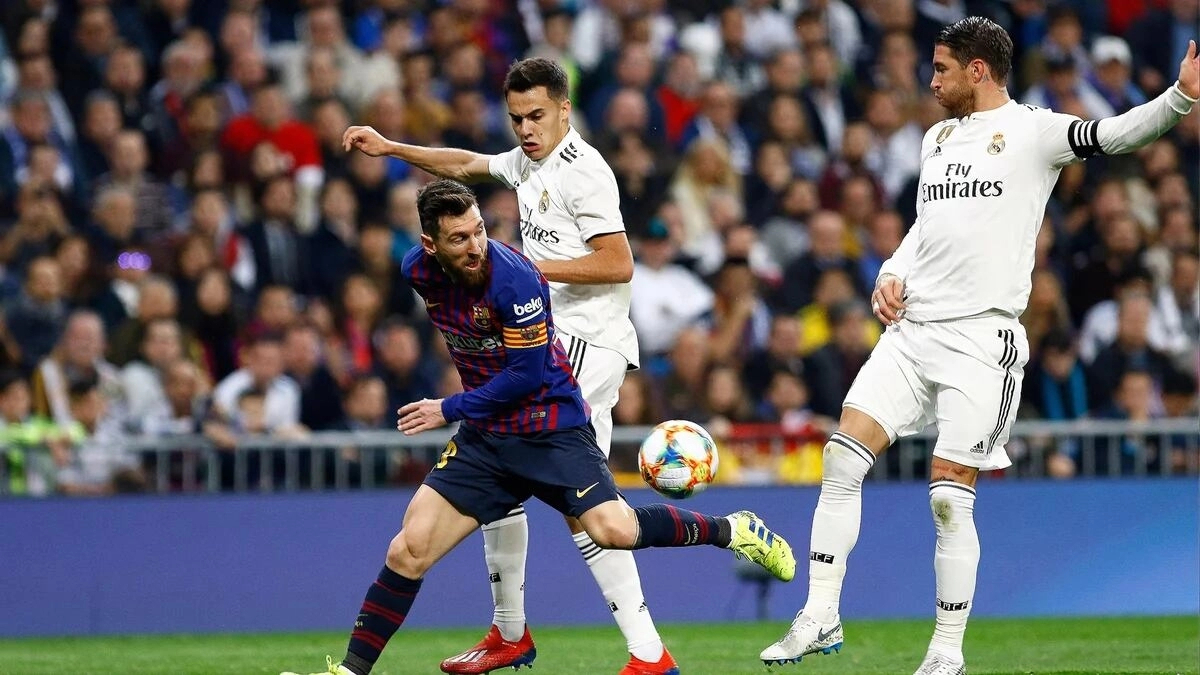 Sergio Reguilón, Sergio Ramos, and Leo Messi during a Real Madrid - FC Barcelona