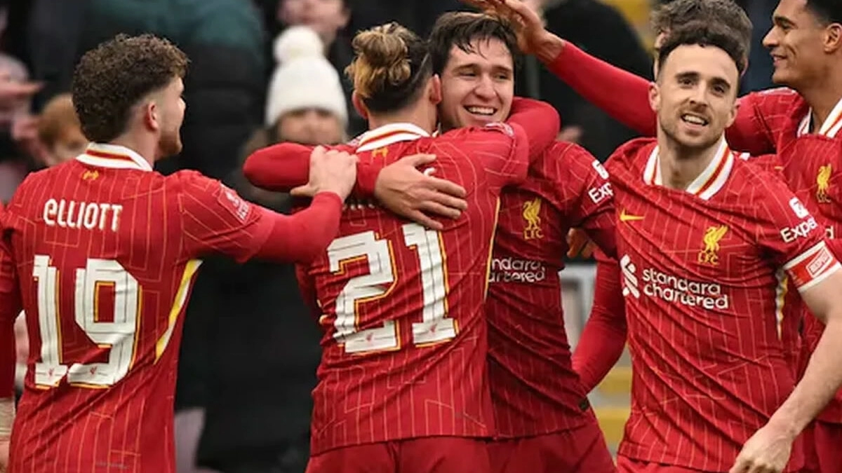 The Liverpool players celebrate a goal.