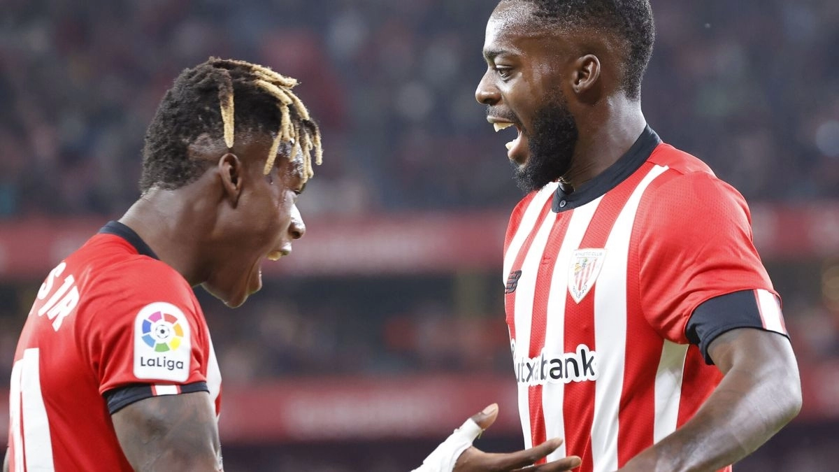 Iñaki Williams and Nico Williams celebrate a goal.