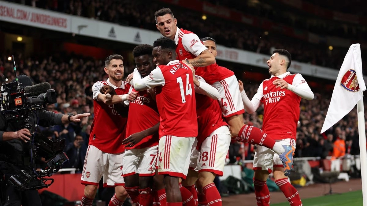 The Arsenal players celebrate a goal.