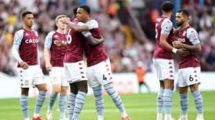 The Aston Villa players celebrate a goal.