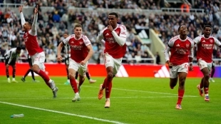 Arsenal players celebrate a goal.