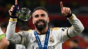 <p>Dani Carvajal celebrates a Champions League with Real Madrid</p>